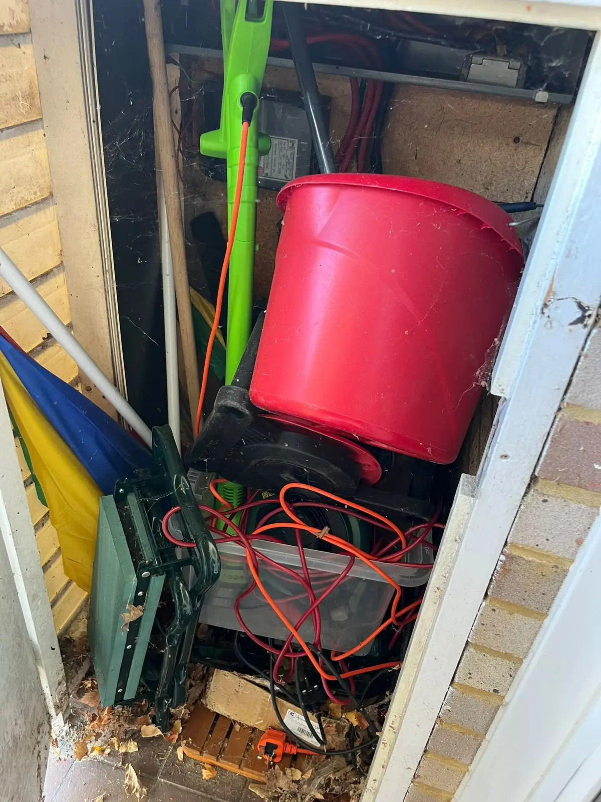 Outside store packed with garden tools and cables